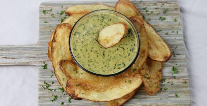 Callaloo Dip accompanied by potato chips